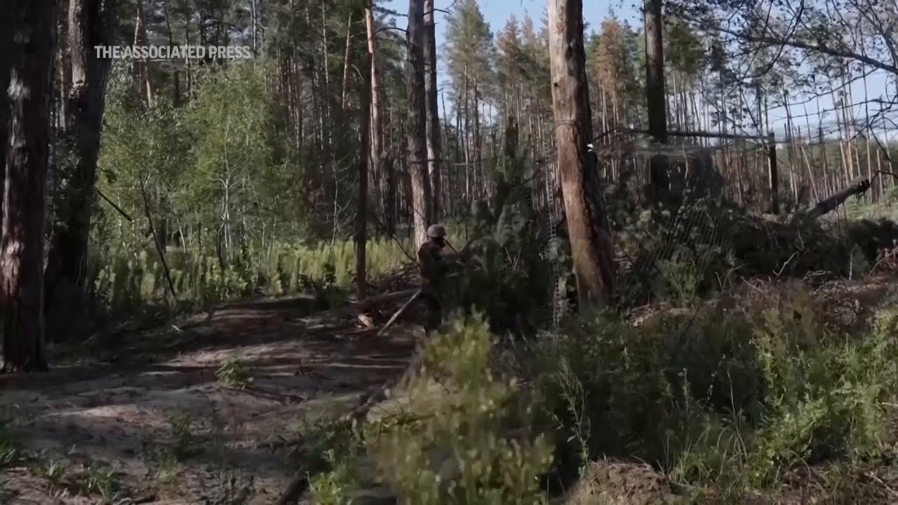 Ukrainian forces fire at Russian positions as Moscow steps up offensive in northeast