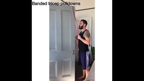 Banded tricep extensions over door frame