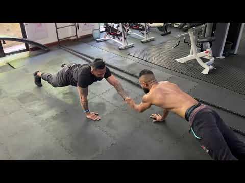 Pushups are one of the most effective upper body exercises. They primarily target your chest and triceps and activate parts of your shoulders. Pushups are typically performed as a solo exercise, but you can make it more fun by adding a high five with your partner in between reps.

To perform this pushup variation:

 	Get into the starting plank position with your head facing your partner’s head. Remember to keep your arms about shoulder-width apart while performing the exercise.
 	Synchronize your movement with your partner as you finish your first rep. Reach over to your partner and high-five them with your left hand while they do the same. Perform another rep, this time high fiving your partner with your right hand. Repeat for as many reps as you both can do.
 	Aim for about three sets of as many reps as you both can perform to get a complete workout.
