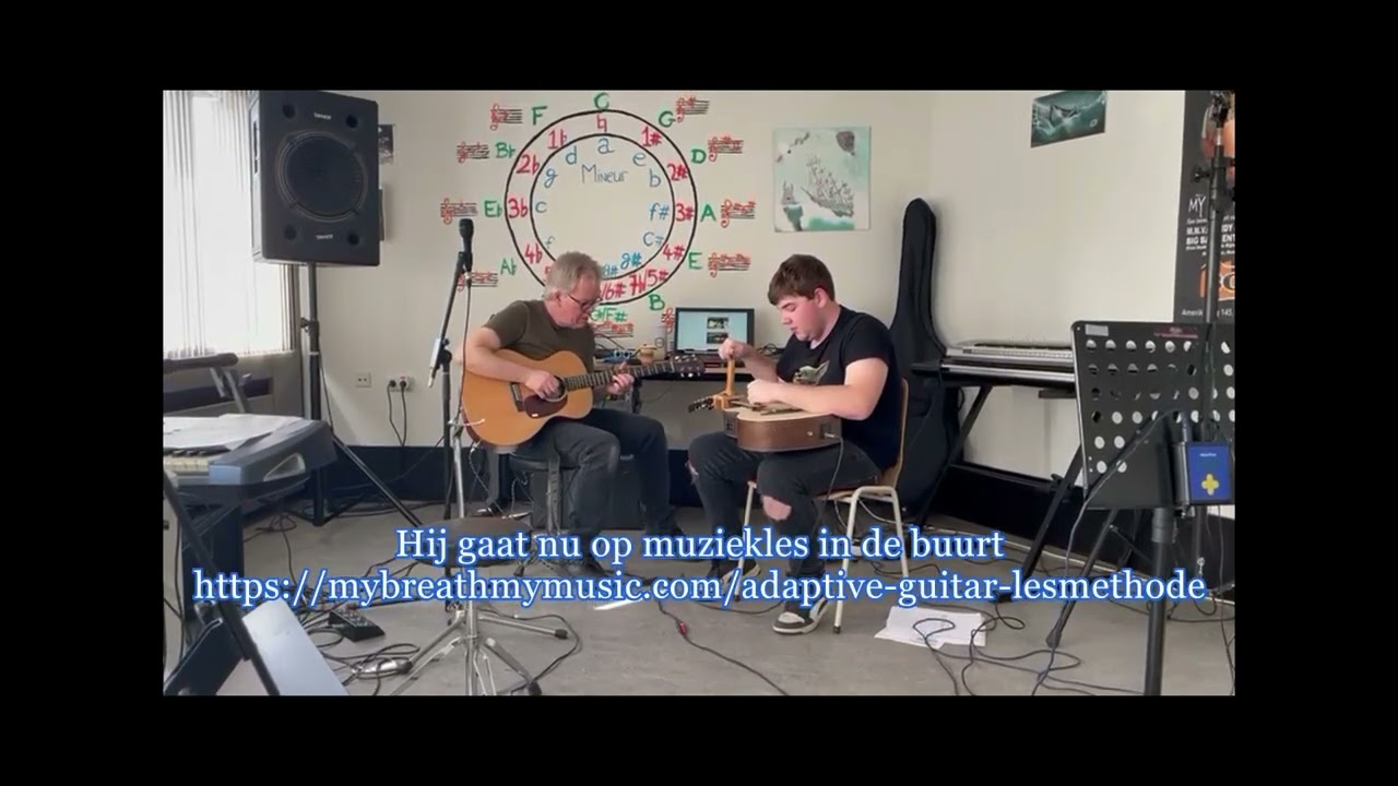 Benno plays  the adapted guitar for people with hemiplegia