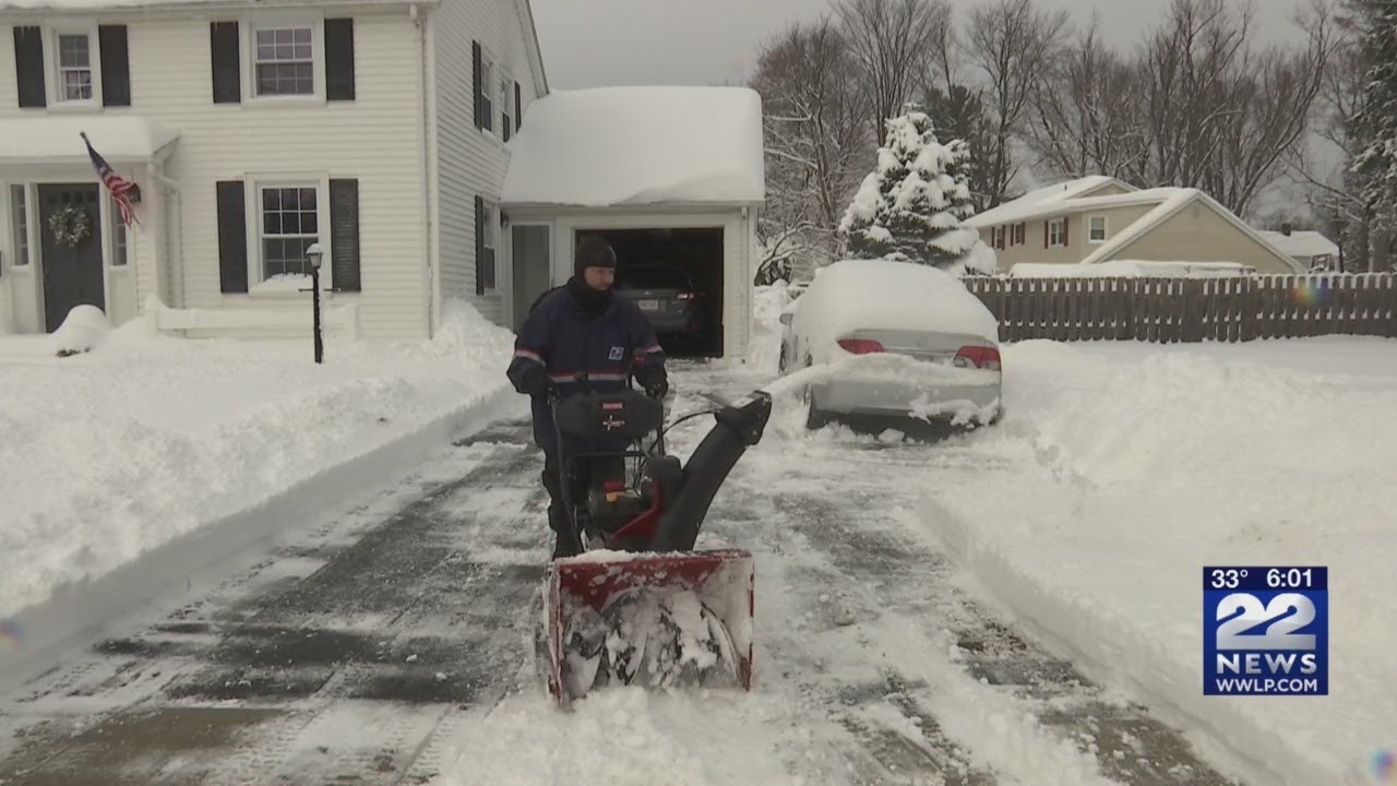 Local residents dig themselves out from second round of snow - YouTube