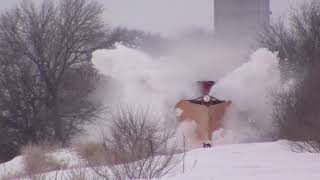 Watch snow drifts explode as train crashes through using old Illinois Central wedge plow