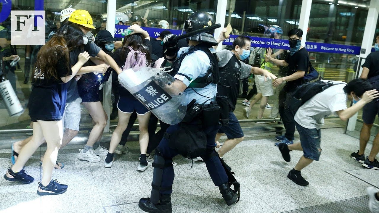 Film backdrop image for Hong Kong protesters clash with police outside airport (2019)