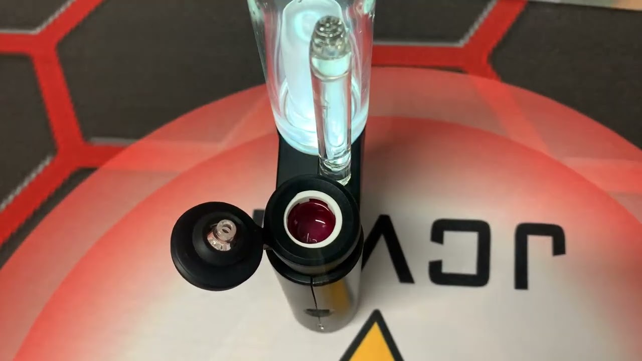 The JCVAP pockety smart dab rig vaping with ruby insert