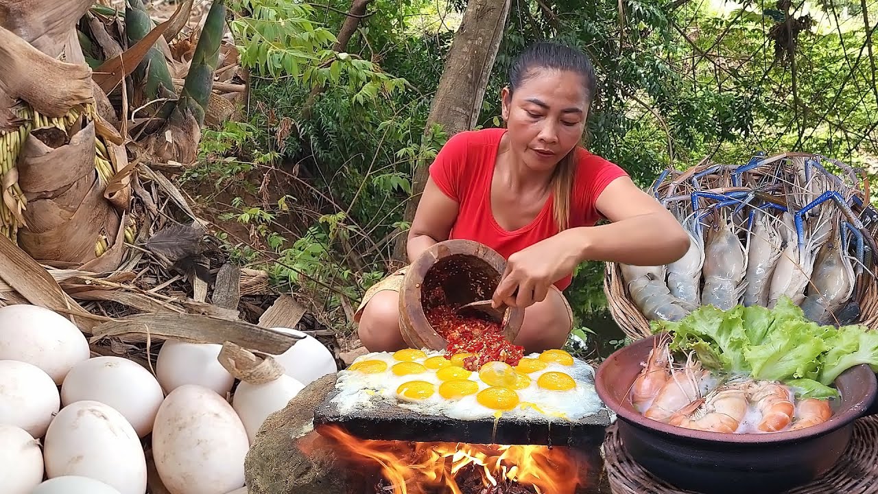 Yummy! Egg tasty cooking on the rock, with Chili saucy, Lobster soup spicy So delicious food