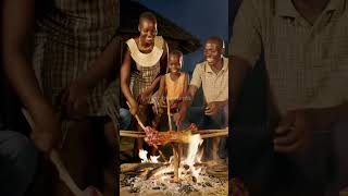 African Wilderness Feast: Traditional Family Cooking Baboon Over Fire.@FlavorHunts-ai