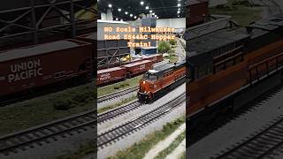 HO Scale Milwaukee Road ES44AC Hopper Train Passes Concrete Plant!