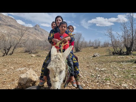 A widow riding a donkey with her children in the mountains