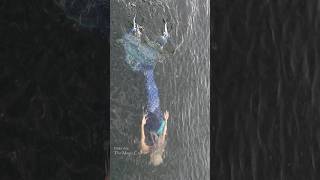 Mermaid rolls off of a raft and into the water (East Jordan, MI)