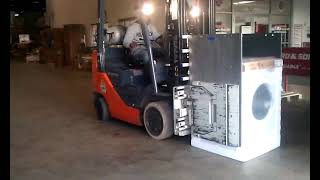 P C Richards warehouse worker uses forklift to load washer and dryer on Ford F150 pickup Easy