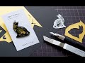 【切り絵×レジン】切り絵で作る 黒猫とドイツ鱗の金魚 ブローチ【ハンドメイドアクセサリー/paper cut art handmade accessory】