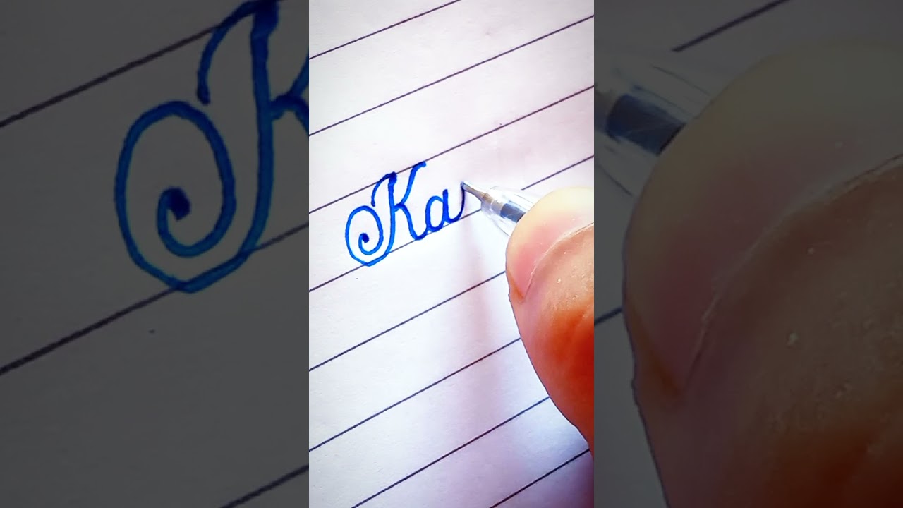 Writing a name "Kajal" in cursive 