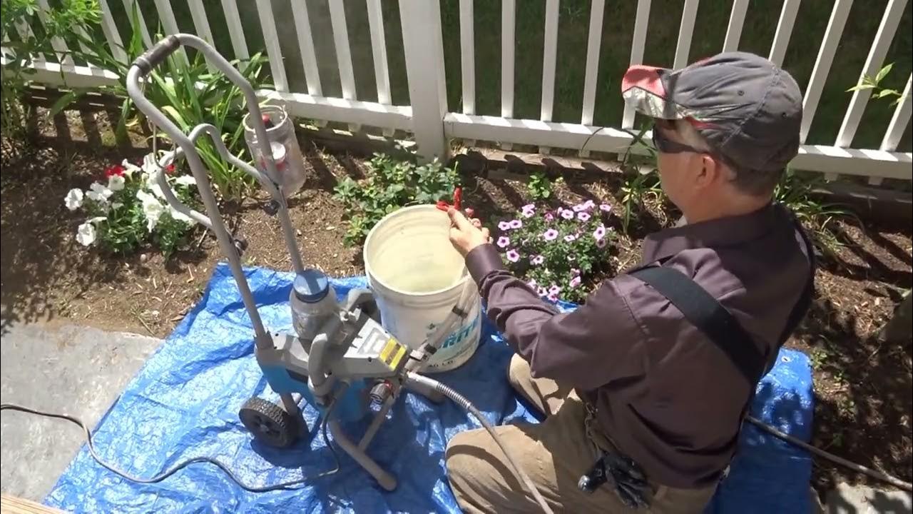 Handyman Staining a Deck with Harbor Freight
