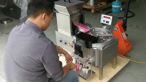 Chocolate tablets counting and packing machine.