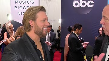Craig Wayne Boyd speaks to Jimmy Carter on the CMA Awards Red Carpet