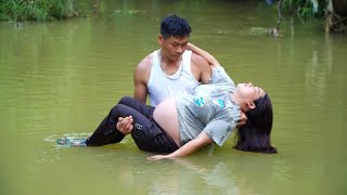 General Director Trieu Long saves a homeless pregnant woman from flood waters.trieu long