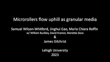 Uphill granular flow of microrobotic microrollers
