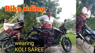 Bike riding wearing koli saree