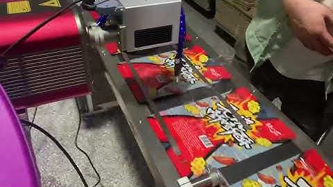 DIKAI CO2 Laser Marking Machine Printing on Pouches on Feeding System