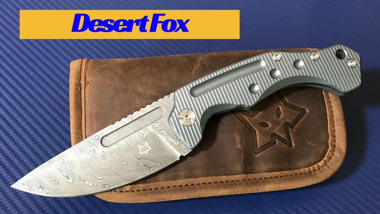 Desert Fox knife by Fox Knives blue titanium framelock with Damasteel