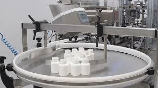 Automated complete line with counting, filling, capping and labelling units.