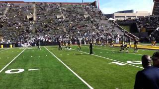 Kirk Ferentz checks wind direction