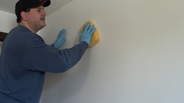 How to remove old wallpaper glue with out chemicals once the wallpaper has been removed