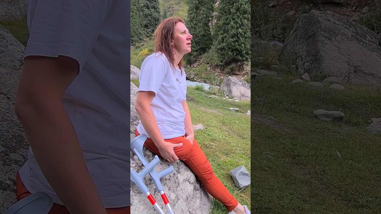 RAK Amputee crutching with red pants and underarm crutches