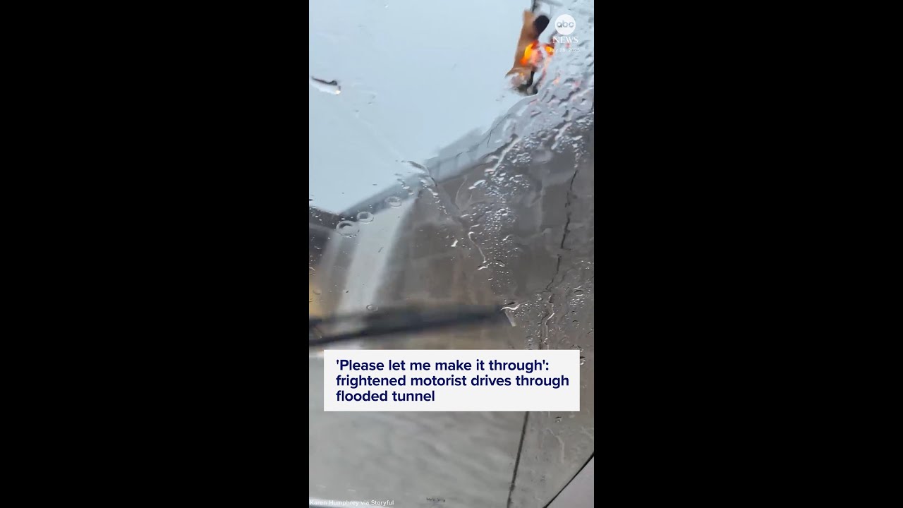 Frightened motorist drives through flooded tunnel - YouTube