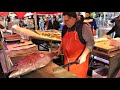 Great Skills Cutting a Whole Huge Tuna. Fish Market in Catania, Sicily. Street Food of Italy