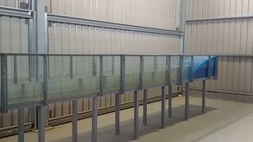 Travelling wave in teaching flume, created by piston wave maker