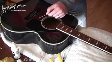 Changing Strings on an Acoustic Guitar - Part 1 - Easy Video
