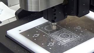Cutting a 2-mm-thick duralumin plate by a CNC milling machine