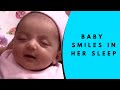 Baby smiling in her sleep with a stupid grin