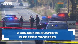 2 carjacking suspects flee from troopers