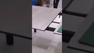 Extending dining table with ceramic top