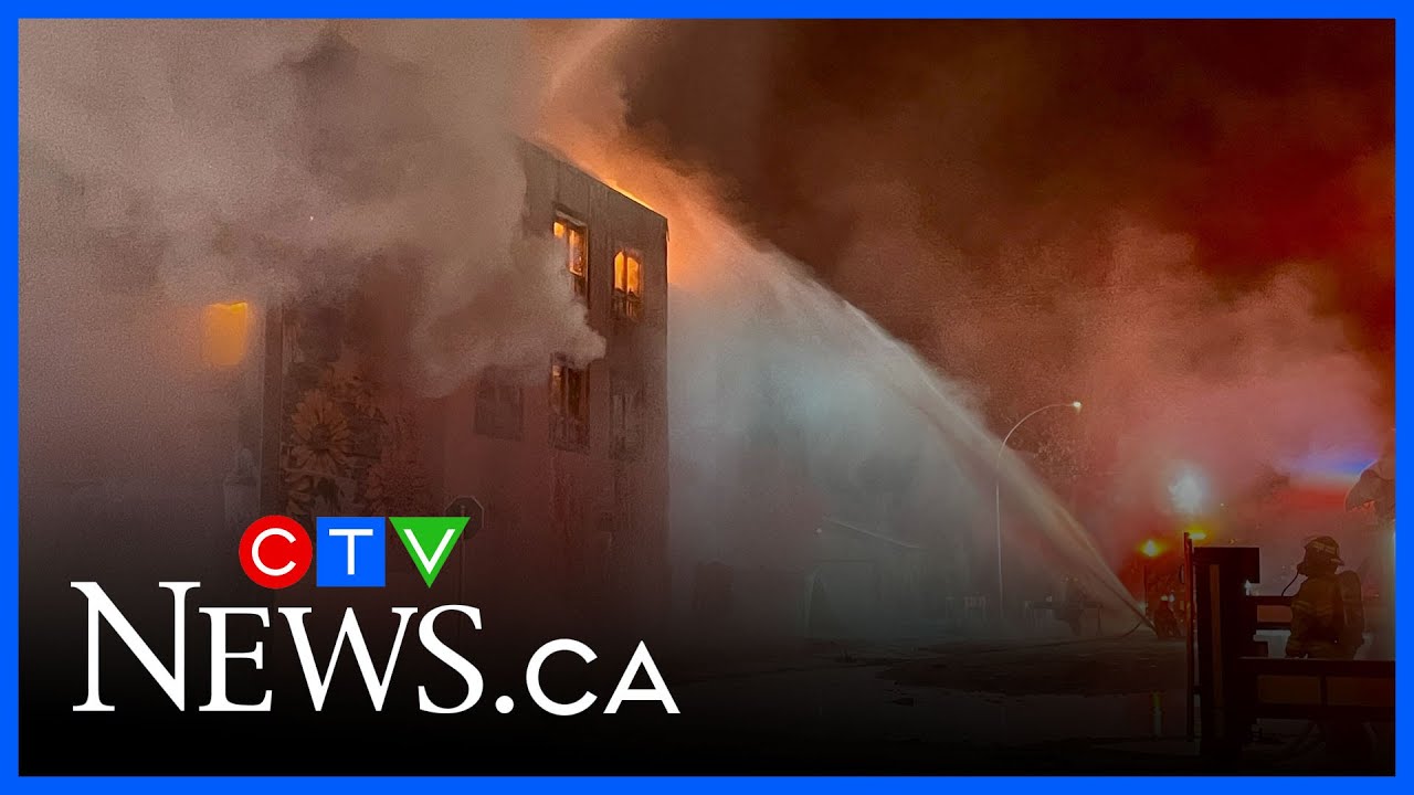 Firefighters battle building blaze in freezing temperatures - YouTube