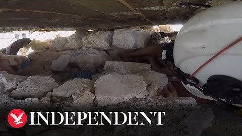 Child rescued from rubble after shelling in Syria