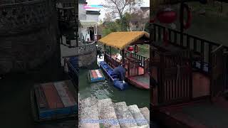 Floating Innovation: How Plastic Barrels Transform a Wooden Boat into a Stable Platform