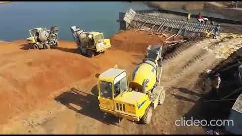 Dam work with Ajax concrete mixer and concrete pump