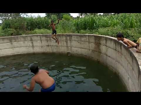 Boys swimming in natural swimming pool