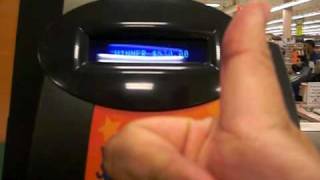 Me using the 'check a ticket' machine (attached to self-service
terminal) scan winning lottery ticket . performed at kroger grocery
store #517 in rich...