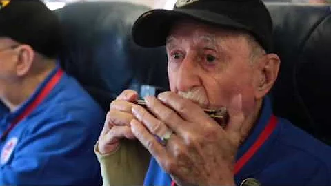 Korean War Marine plays harmonica