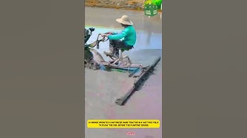 Hand-Motorized Tractor in Wet Rice Fields to Plow the Land Before Planting Season