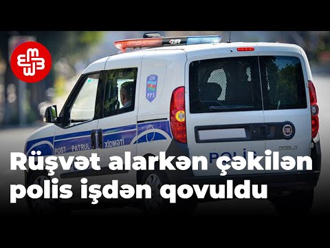 Rüşvət alarkən görüntülənən polis xidmətdən qovuldu