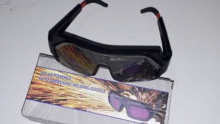 Automatic darkening welding glasses