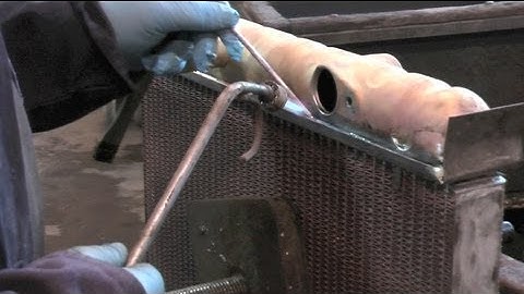 Recoring a Jaguar E-type radiator with an upgraded copper and brass core.