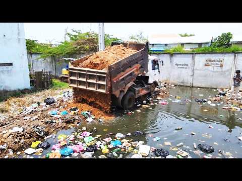 Breathtaking! A tipper alliance and a mighty crawler seal a flooded, polluted bog.