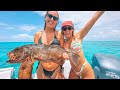 Dream life in the great barrier reef girls spear monster coral trout catch  cook crispy skin