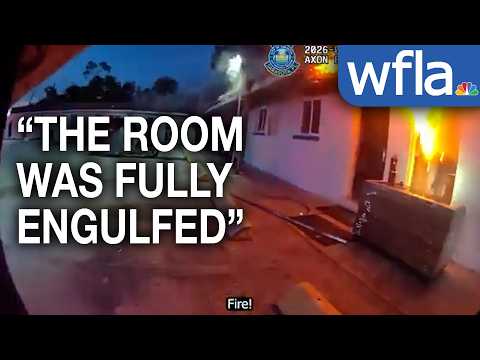 Sarasota Police officers run toward burning motel to save guests